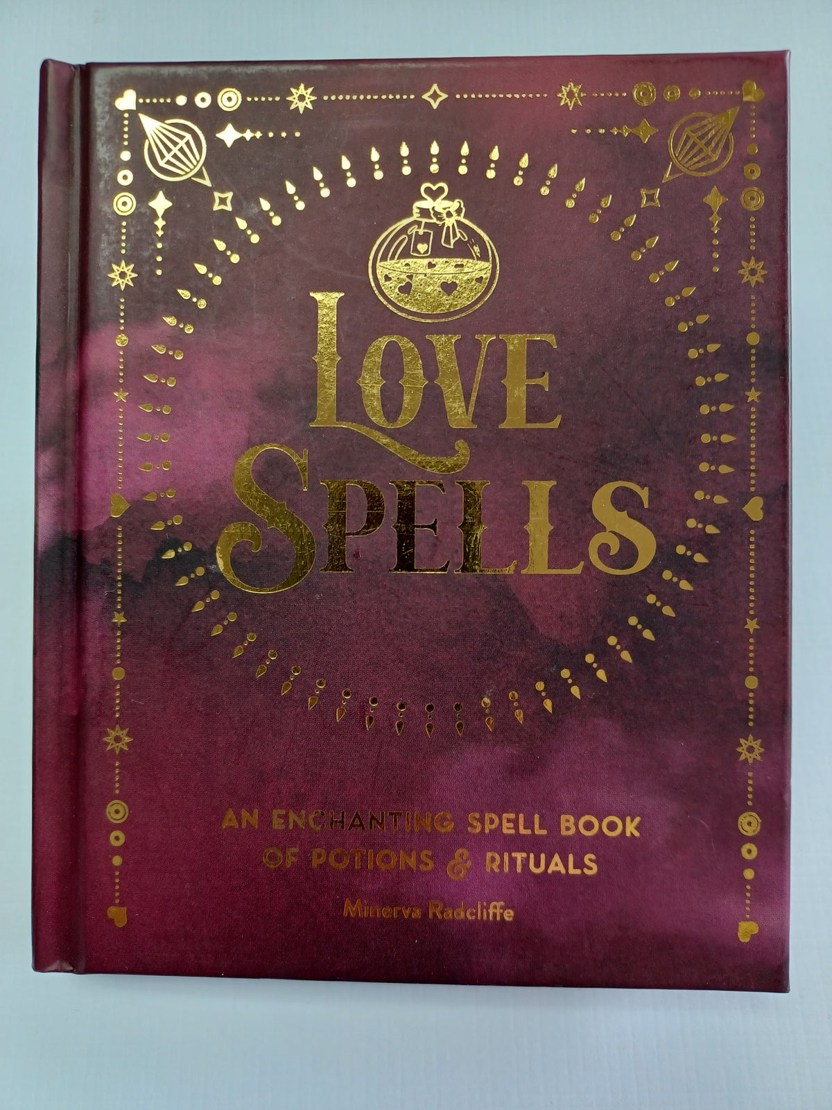 Love Spells:An Enchanting Spell Book of Potions and Rituals by Minerva Radcliffe